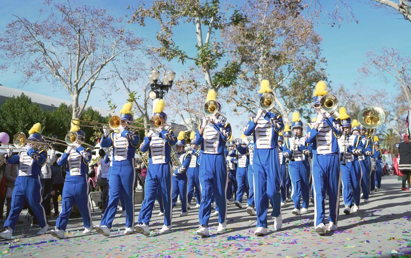 Marching band performing with confetti in the air
