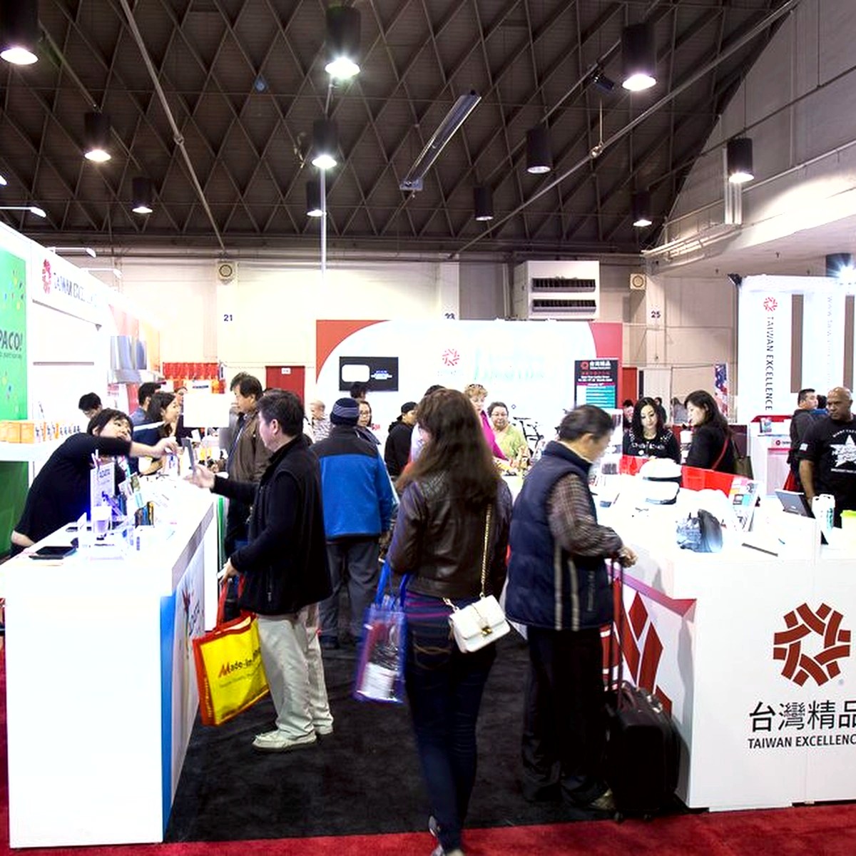 Vendors and attendees at trade-show style exhibit booths